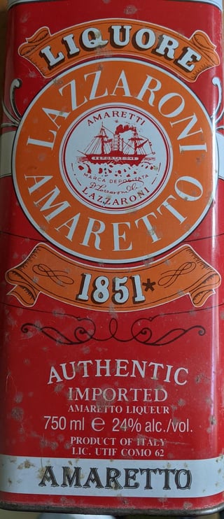 front of Amaretto Di Sarrono tin box