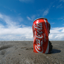 coke can on the beach